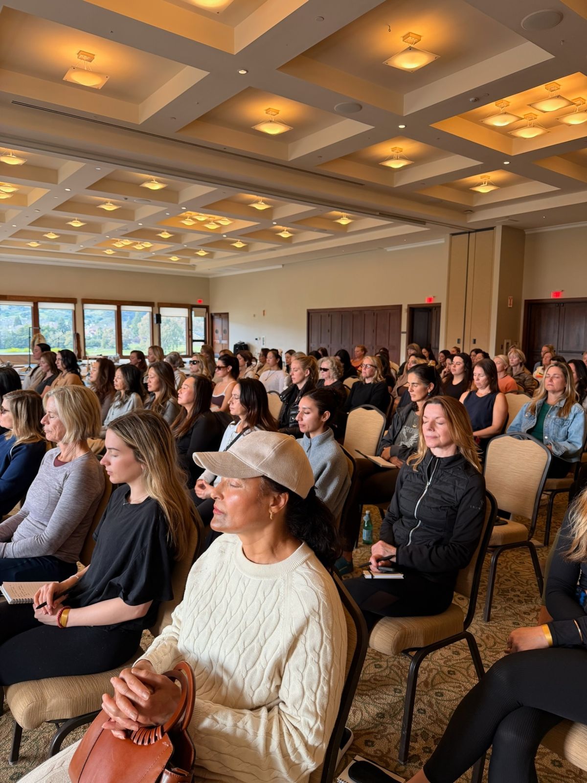Audience in meditation at Emerge As Everything event